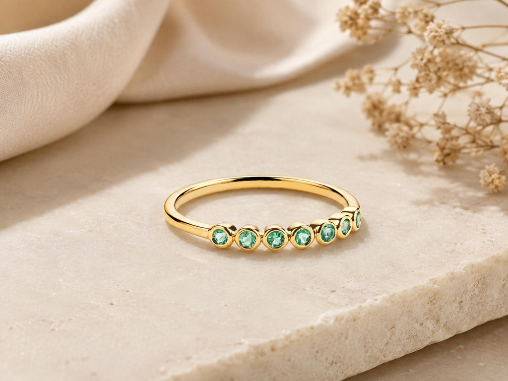 Bezel Emerald Half Eternity Band – 2.5mm in solid gold